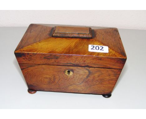 A Victorian sarcophagus shaped tea caddy.