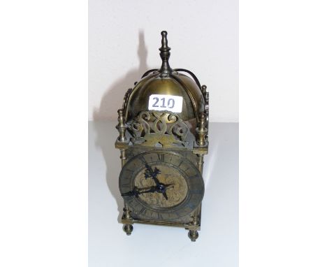 A solid brass lantern clock.