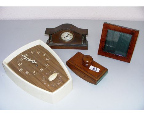 A maple photograph frame, mahogany desk blotter, small metal clock & kitchen clock.