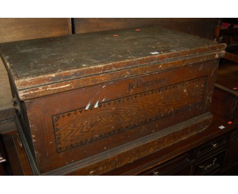 A Victorian stained pine hinge top tool chest, having iron end carry handles