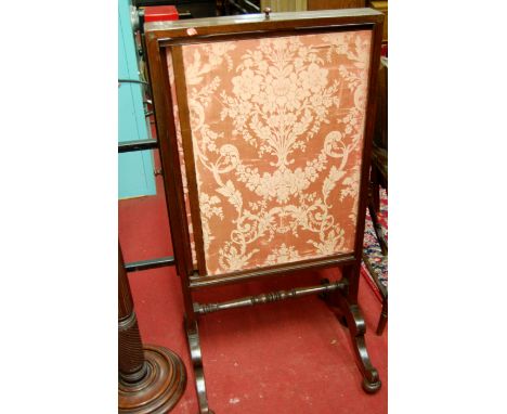 A 19th century mahogany floral silk inset fire screen, having two adjustable inset panels 