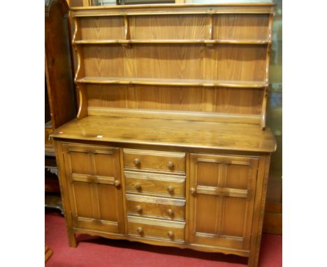 An Ercol mid elm dresser