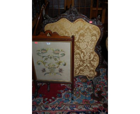 A Rococo style carved mahogany framed and floral damask inset fire screen, together with two further mahogany framed fire scr