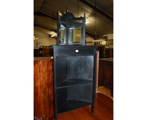 An Edwardian and later black painted mirror inset freestanding open corner shelf