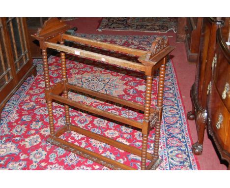 An early 20th century bobbin turned oak towel rail 