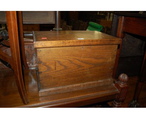 A small 19th century oak hinged top tool chest 