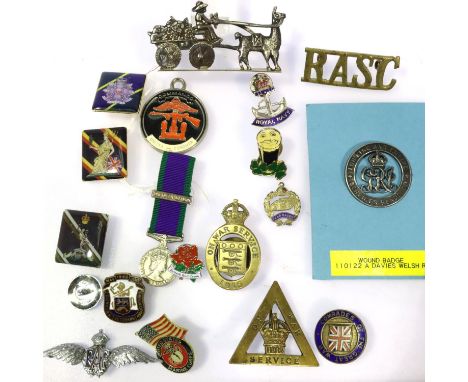 Mixed military badges to include a wound badge to A Davies, Welsh Regiment and a miniature Northern Ireland GSM. P&amp;P Grou
