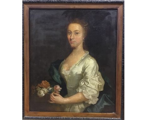 English school, 18th Century, portrait of a young lady, half length wearing a white satin dress and blue wrap, holding flower