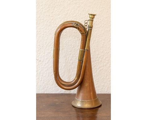 A copper and brass bugle.&nbsp;