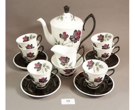 A Royal Albert Masquerade coffee set comprising: coffee pot, six cups and saucers, sugar and milk 