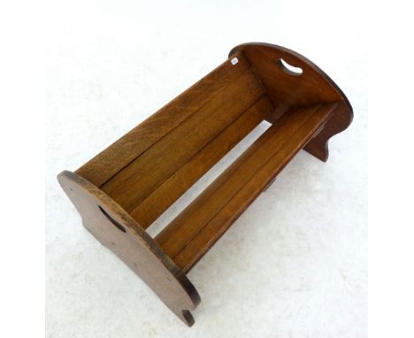 An Edwardian oak extending book trough 