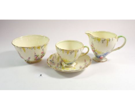 A 1930's Foley tea service printed garden flowers comprising: seven cups and saucers, two jugs, twelve tea plates, sugar and 