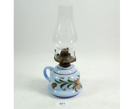 A Victorian blue glass floral painted finger lamp 