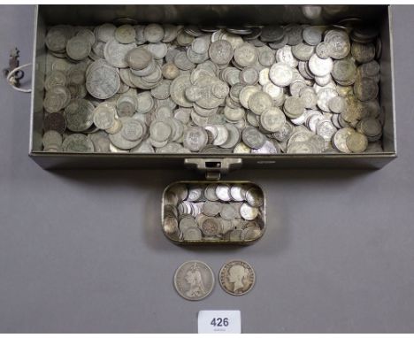 A metal strong box with key containing quantity of silver content coinage: pre 1920 silver threepences in tobacco tin and loo