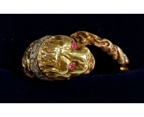 An 18ct gold ring in the form of a leopards head and tail set diamond collar and ruby eyes, size K-L, 9.2g 