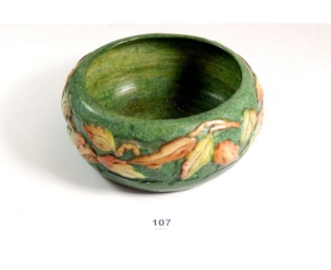 A Compton Pottery Mary Watts fruit bowl with foliage decoration, 19cm diameter 