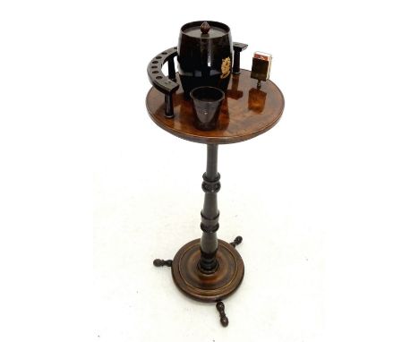 A mahogany Victorian smokers table, including pipe rack, tobacco jar, vesta holder and cup 