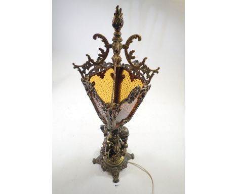 A gilt metal and marble table lamp with floral spray and cherub stem, 40cm high 