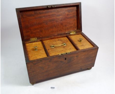 A 19th century rosewood tea caddy on ball feet 