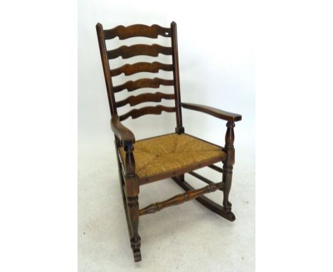 A rush seated ladder back nursing chair 