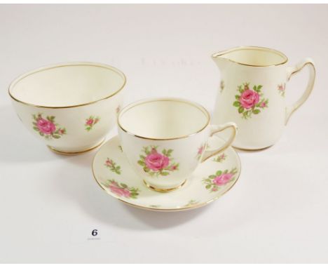An Adderley vintage tea service printed roses comprising: six cups and saucers, milk, sugar, cake plate and six tea plates 