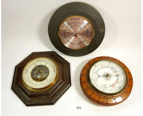 An oak circular barometer, an octagonal one and a slate cased one 