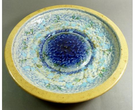 A Royal Doulton Art Pottery bowl with experimental glaze in shades of blue, 30.5cm diameter with FM mark to base (This item c