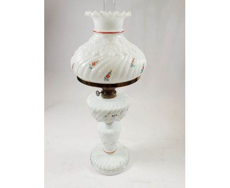 A Victorian opaque white glass oil lamp and matching shade, painted flowers 