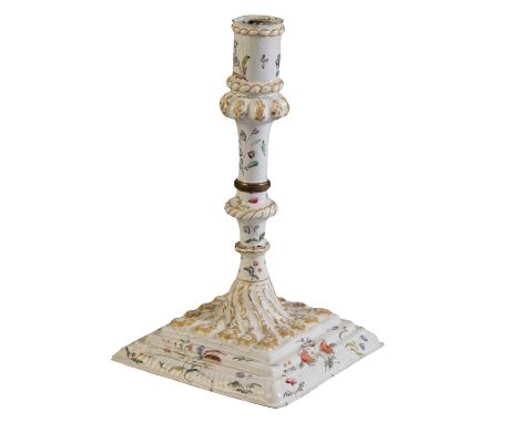 A RARE SOUTH STAFFORDSHIRE ENAMEL CANDLESTICK circa 1770, with a stepped square base supporting a knopped stem, decorated in 