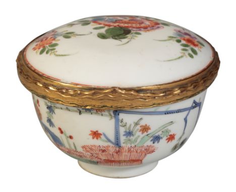 A MEISSEN CIRCULAR SNUFF BOX formed from a tea bowl, painted with the "Three Friends" issuing from two banded hedges in the K