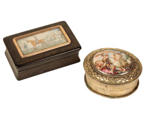 A CONTINENTAL WHITE METAL AND PORCELAIN SNUFF of oval form, the porcelain lid painted with a lady amongst floral swags and pu