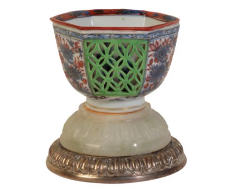 A CHINESE TEABOWL Kangxi, with later Dutch 'clobbered' decoration, of hexagonal form with pierced lattice panels, on an assoc