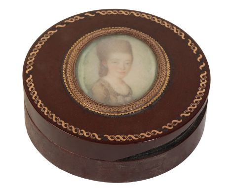 A LOUIS XV COMPOSITION SNUFF BOX of circular form, the lid set with a portrait miniature of a lady, within a gilt metal borde