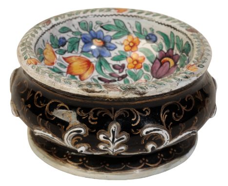 A LIMOGES ENAMEL CIRCULAR SALT 17th century, enamelled in polychrome with flowers within feathery leaf borders, the exterior 