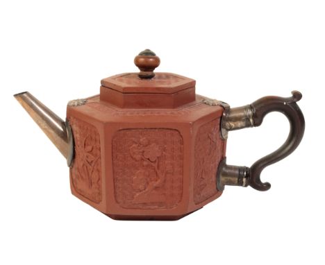 A 'RED' YIXING HEXAGONAL TEAPOT Kangxi period, each side moulded with flowers on a diaper-patterned ground, wooden scroll han