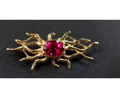HEAVY UNIQUE 18 CARAT GOLD BROOCH (TESTED TO) SET WITH A 7 CARAT RUBY