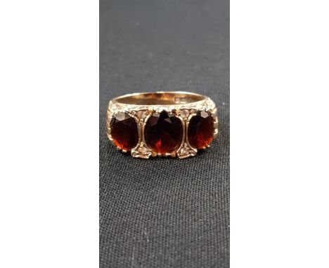 9 CARAT GOLD 3 STONE GARNET RING