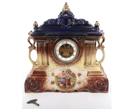 A 19th century painted ceramic cased mantle clock, the elaborate case painted with a rural scene, with gilt applied decoratio