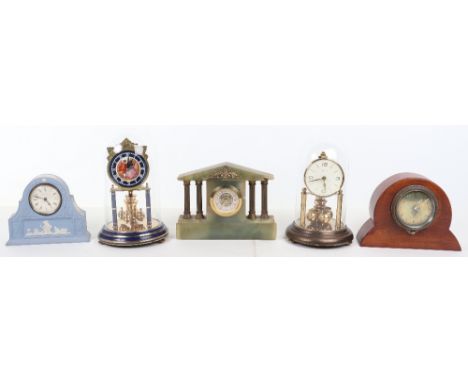 Five mantle clocks, including a Wedgewood clock, two anniversary clocks, a small green onyx clock and a wooden cased clock si