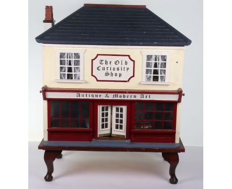 Scratch Built Antiques Shop Dolls House, contemporary made wooden/painted, removable front, on wheels, complete with dolls ho
