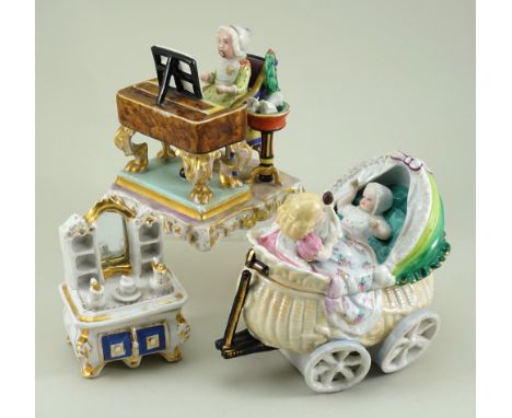 A Pirkenhammer porcelain Baby at Piano group, marked CF (C Fischer) mid 19th century, Baby seated in a high chair with holly 