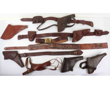 A selection of leather holster and ammunition pouches, including a holster stamped N.W.M.P (North West Mounted Police), a hol