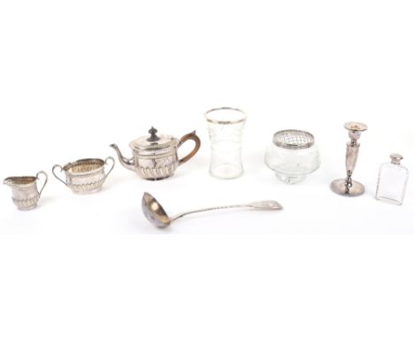 A mixed lot of silver and silver plate, including a 925 stamped candlestick, a silver rim glass vase, a rose bowl, a silver p