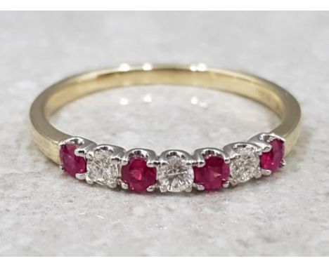 Ladies 9ct yellow gold ruby and diamond band ring, comprising of 4 round rubys set with a diamond inbetween, 3 in total, all 