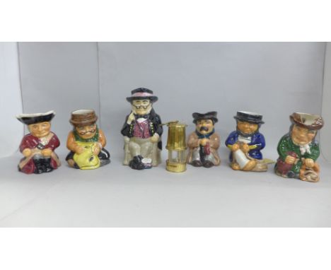 Six Toby jugs and a small brass miner's lamp 