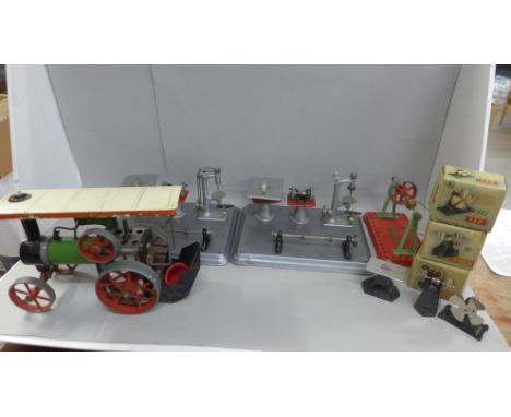 An early 1960's traction engine with instructions and accessories including a line shaft, model fan, model grinder and model 