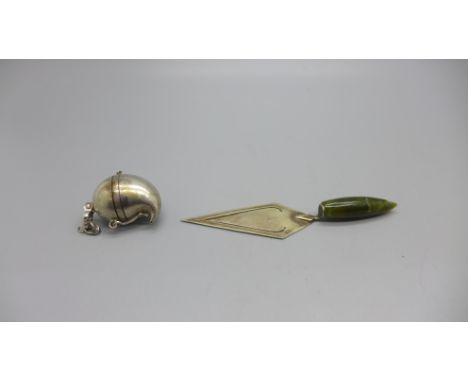 A trowel bookmark and a pill box/charm 