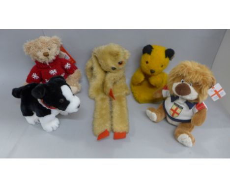 A vintage Chad Valley Sooty glove puppet, a Hamleys limited edition Snowflake bear, England football mascot bear, soft dog wi