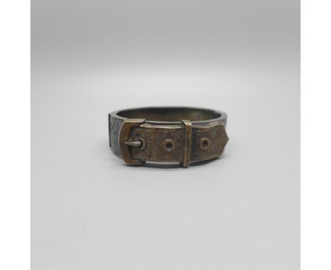 A Victorian silver buckle bangle, Birmingham 1882, 26g, some dents 