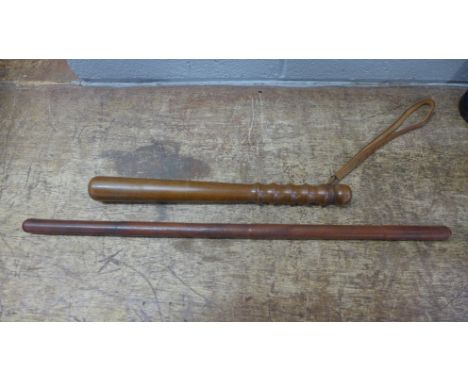 A Police truncheon and a leather covered swagger stick 